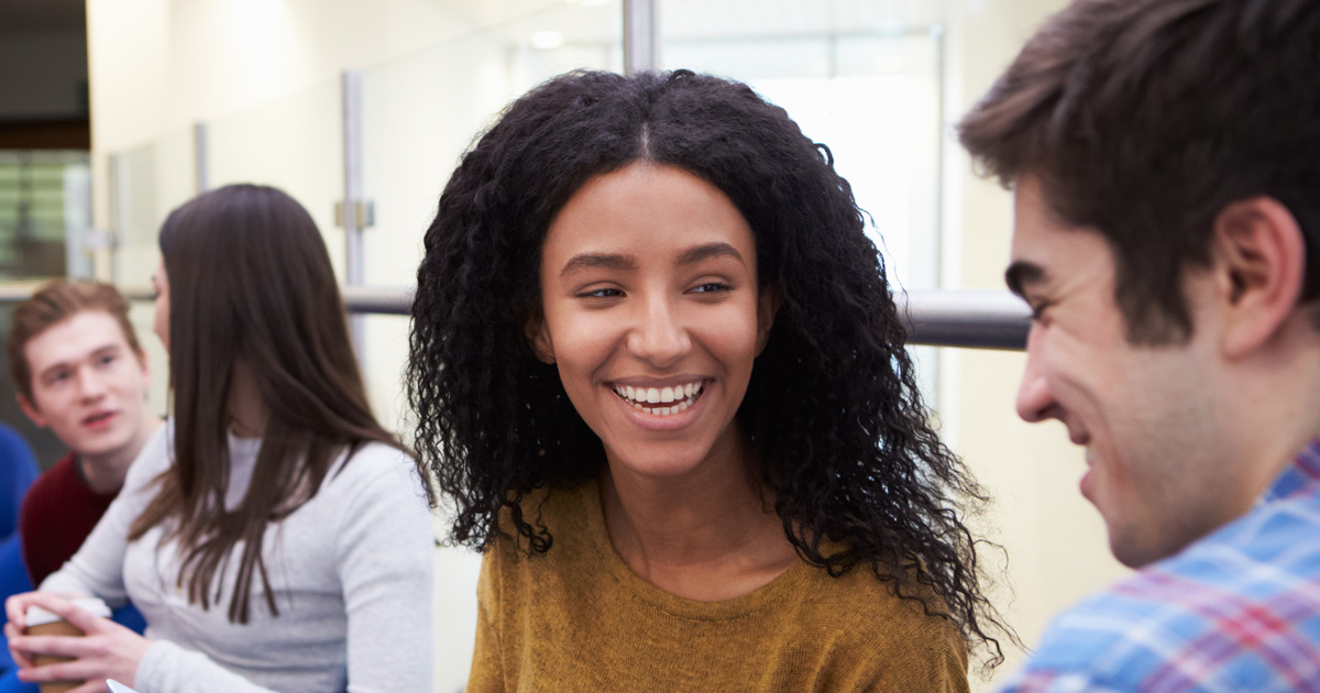 2023 First Year Student Motivations Report: students in a lobby talking