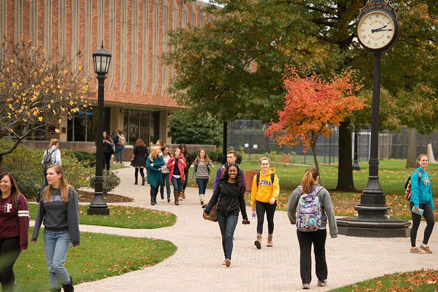 Elmira College: Students walking through the campus on the sidewalk