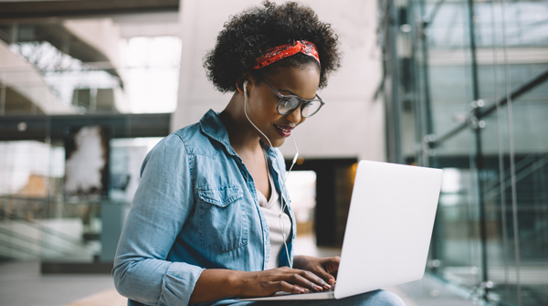 Image of female student working on a laptop computer